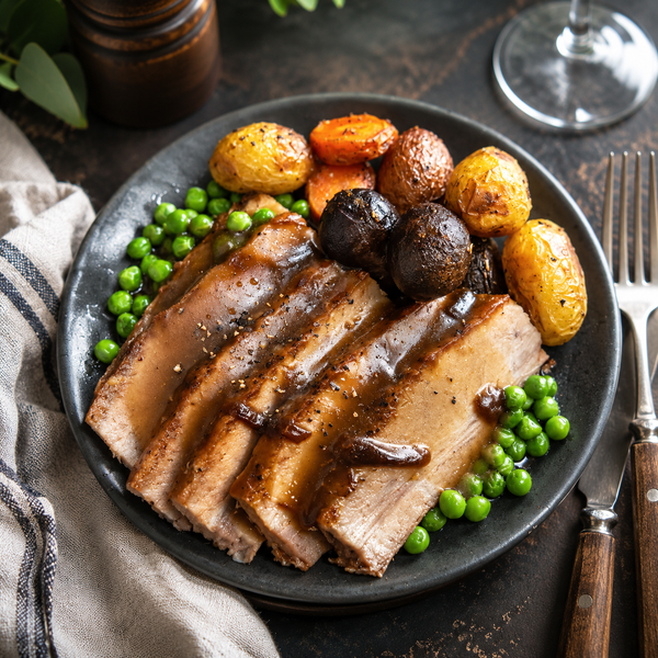 Plate of slow-roast pork belly from The Family Kitchen NZ