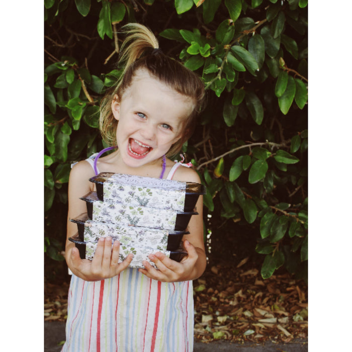 A child holding The Family Kitchen meals