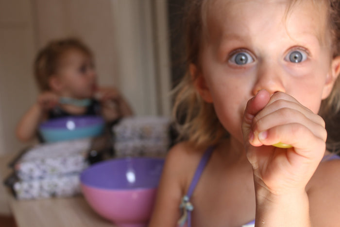 Children enjoying their meals at the table
