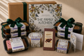 The Family Kitchen Celebration Essentials gift with four chef-made meals, two desserts, Whittaker's chocolate, roasted peanuts and a congratulations card.