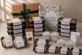 The Family Kitchen New Parent Survival Box with twelve meals, six desserts, three roasted-peanut snack packs, two Breakfast Bagels, Whittaker's chocolate and a premium card.