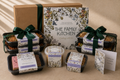The Family Kitchen Recovery Essentials package with four chef-made meals, two desserts, seasoned roasted peanuts and a handwritten recovery card.