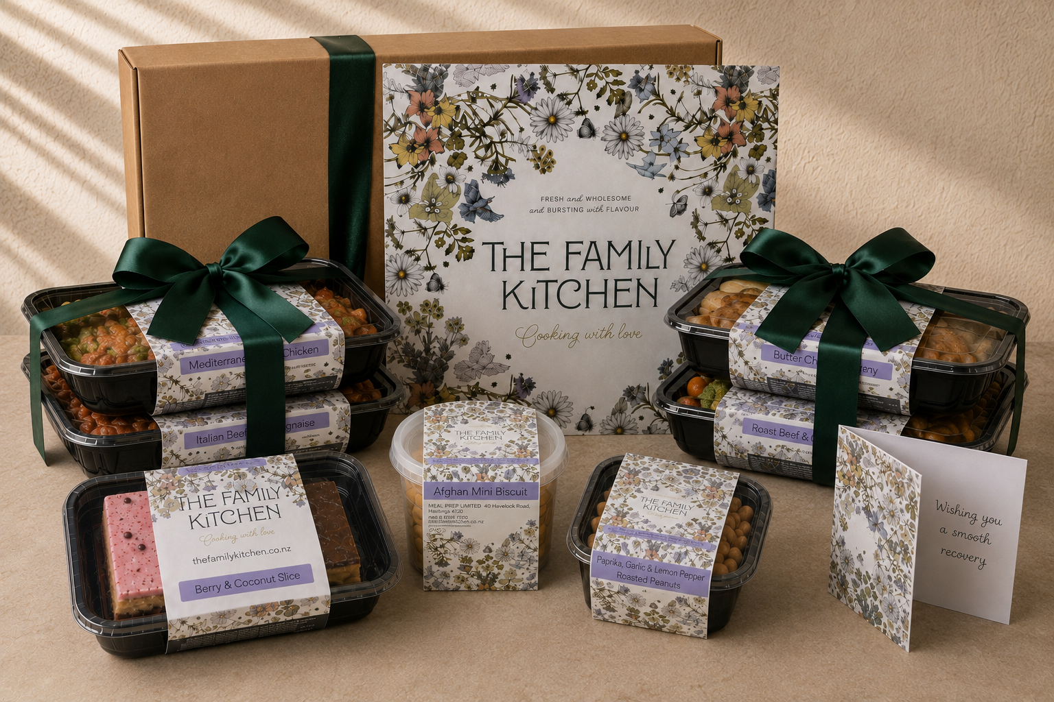 The Family Kitchen Recovery Essentials package with four chef-made meals, two desserts, seasoned roasted peanuts and a handwritten recovery card.
